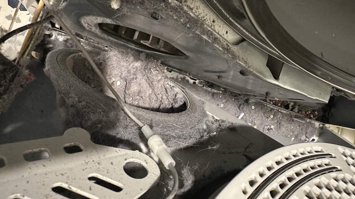 Fixar Appliance Repair technician performing detailed dryer maintenance